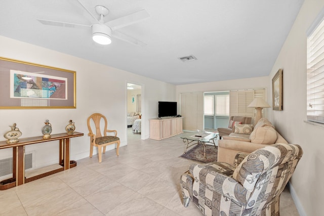 living room featuring ceiling fan