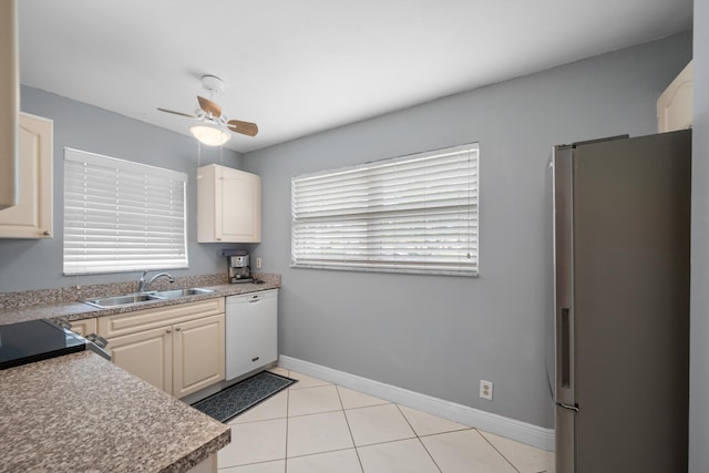 kitchen with white dishwasher, sink, ceiling fan, light tile patterned flooring, and stainless steel fridge with ice dispenser