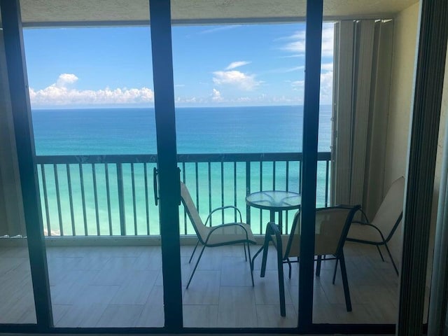 balcony featuring a water view