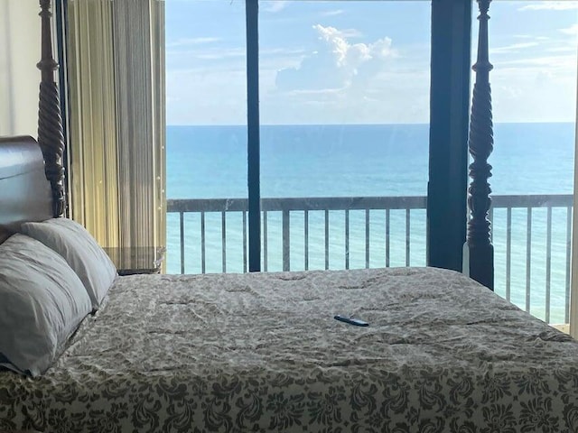 bedroom featuring a water view