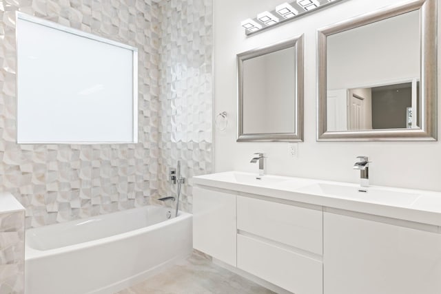 bathroom with double vanity, tub / shower combination, and a sink