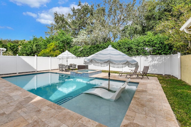 view of pool with an in ground hot tub and a patio