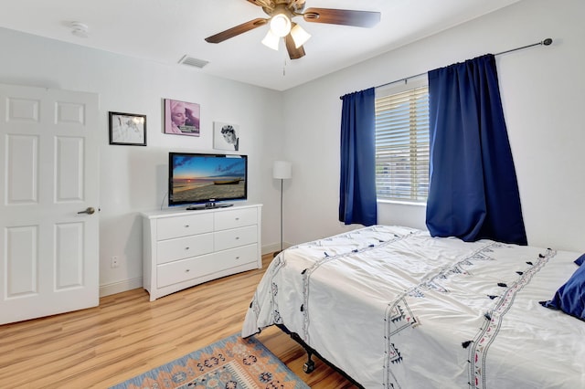 bedroom featuring ceiling fan and light hardwood / wood-style floors