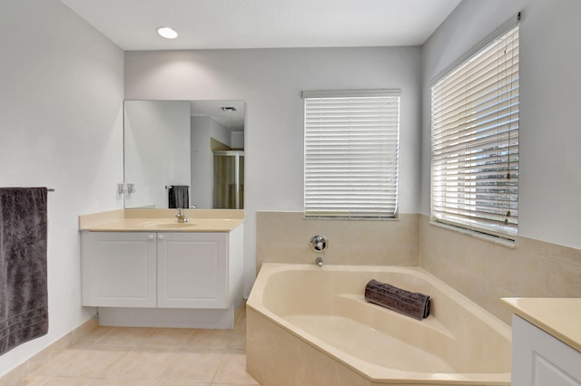 bathroom with vanity, tile patterned floors, and separate shower and tub