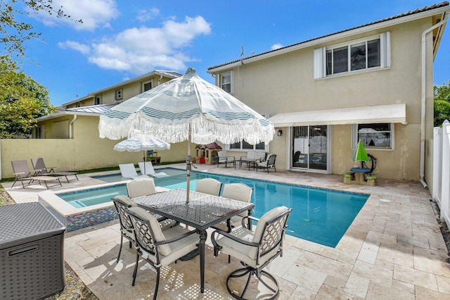 view of swimming pool with an in ground hot tub and a patio