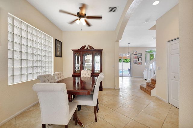 dining room with ceiling fan and light tile patterned floors