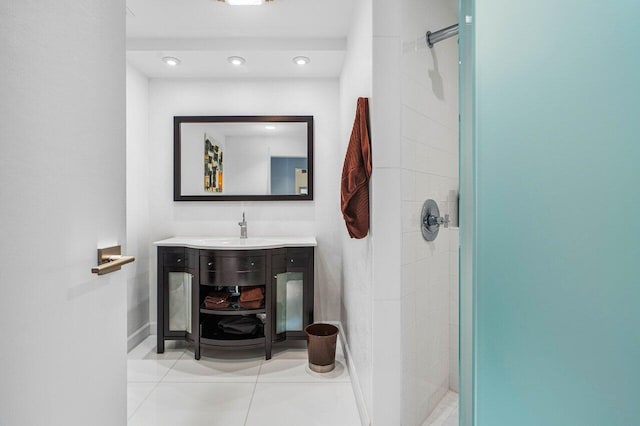 bathroom featuring tile patterned floors, vanity, and walk in shower