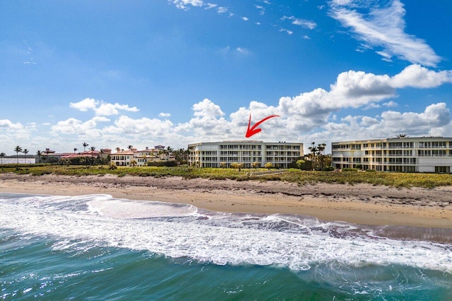 exterior space with a beach view and a water view