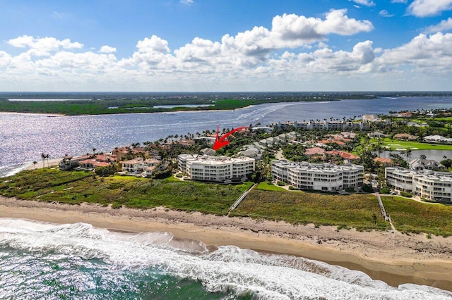 drone / aerial view featuring a view of the beach and a water view