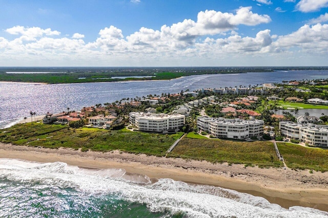 bird's eye view featuring a beach view and a water view