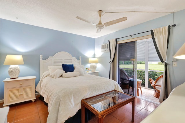 tiled bedroom featuring ceiling fan, a textured ceiling, a wall mounted AC, and access to outside