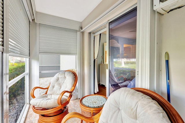 sunroom featuring a wall mounted AC