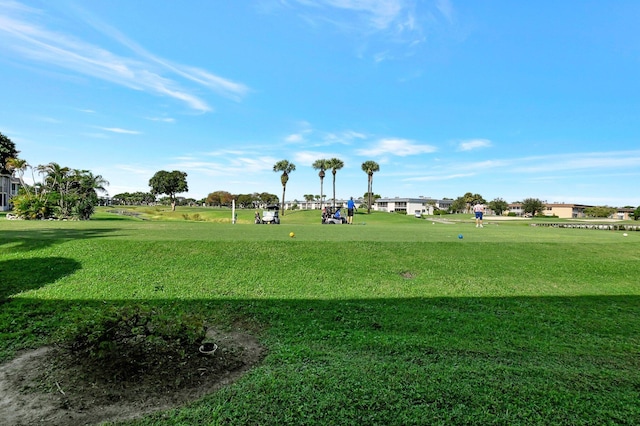 view of property's community featuring a lawn and a playground