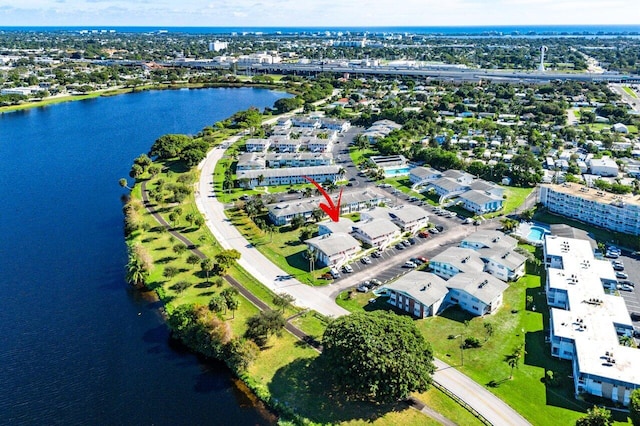 birds eye view of property with a water view