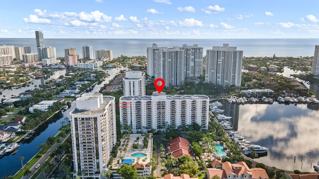 birds eye view of property with a water view