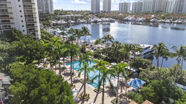 birds eye view of property with a water view