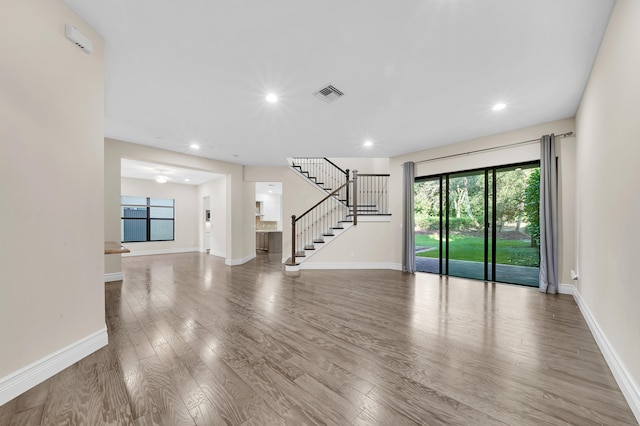 unfurnished living room with hardwood / wood-style floors