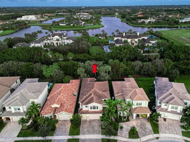 birds eye view of property featuring a water view