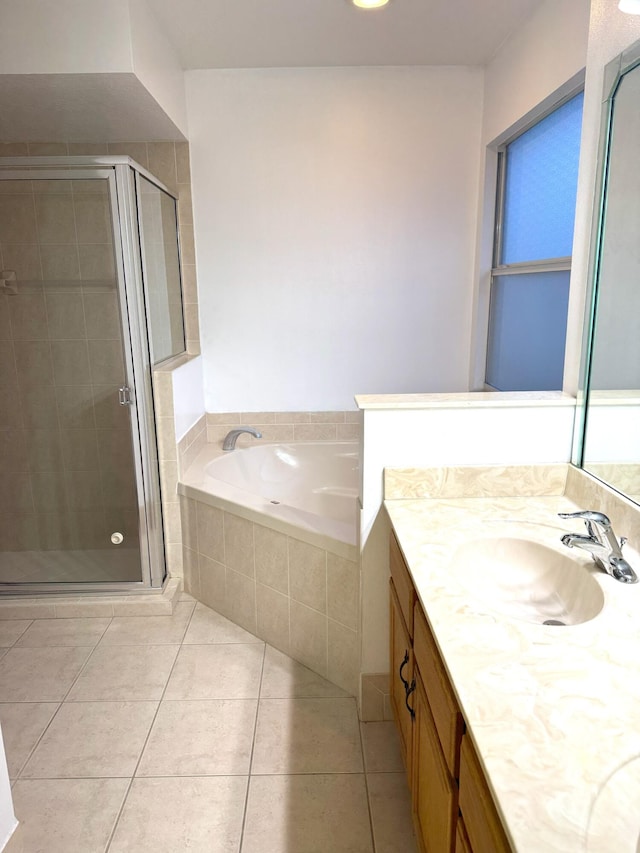 bathroom with vanity, tile patterned floors, and separate shower and tub