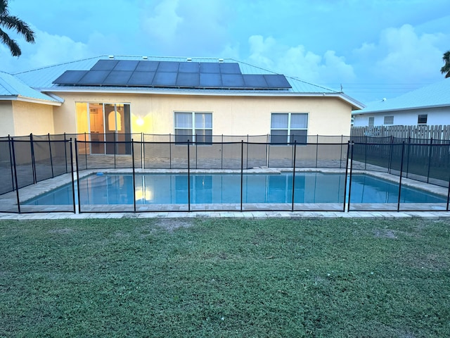 view of pool featuring a yard