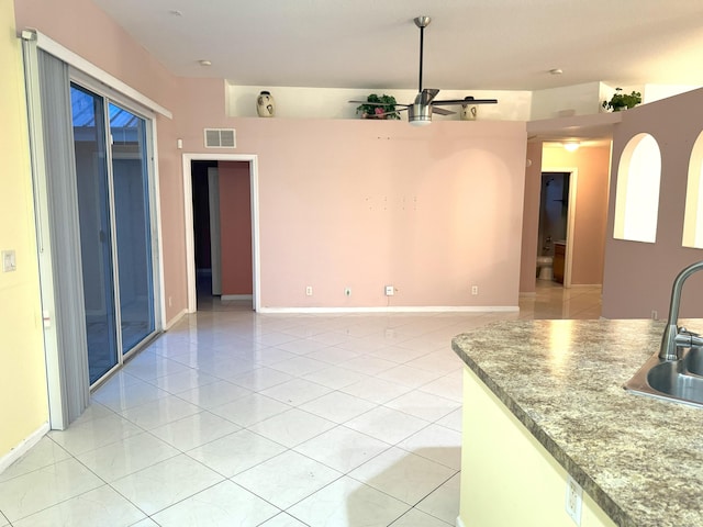 kitchen featuring sink and light tile patterned floors