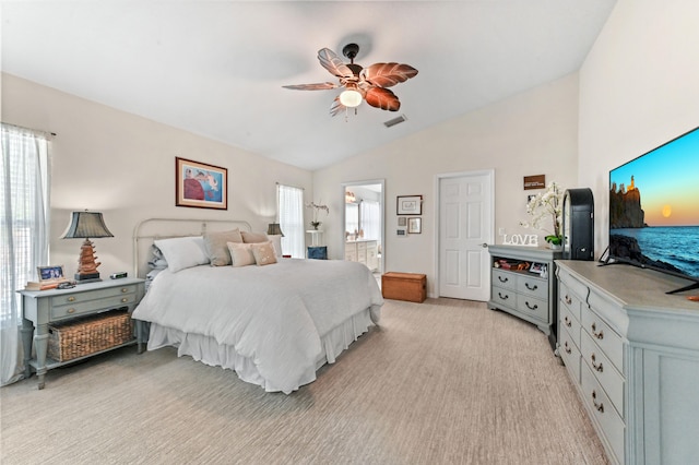 carpeted bedroom featuring connected bathroom, ceiling fan, and lofted ceiling