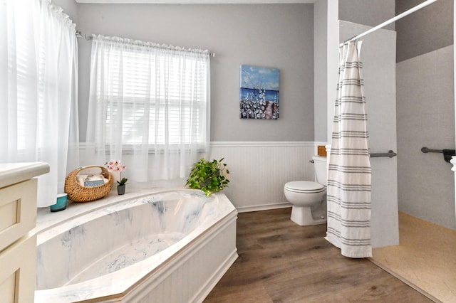 bathroom with hardwood / wood-style floors, plus walk in shower, and toilet