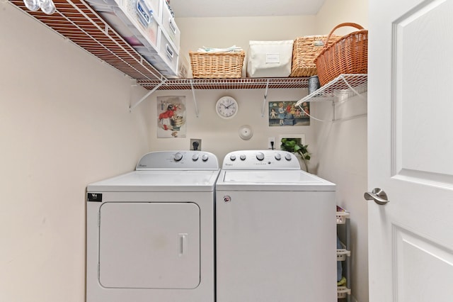 washroom with washer and dryer