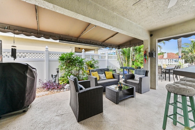 view of patio with area for grilling and an outdoor hangout area