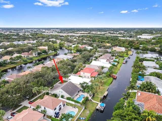 birds eye view of property featuring a water view