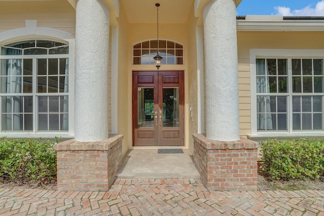 entrance to property featuring french doors