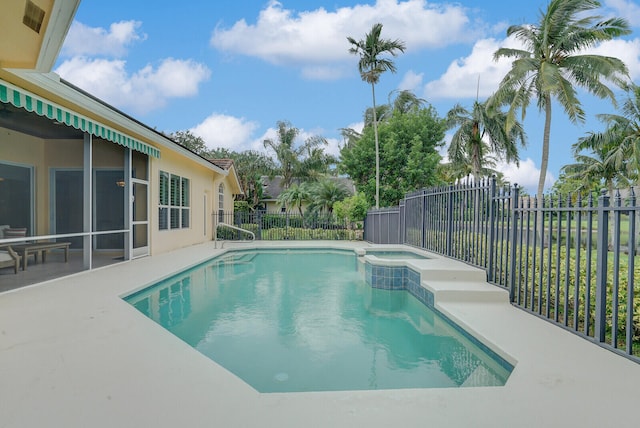 view of swimming pool with a patio area and an in ground hot tub