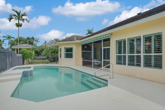 view of pool with an in ground hot tub and a patio