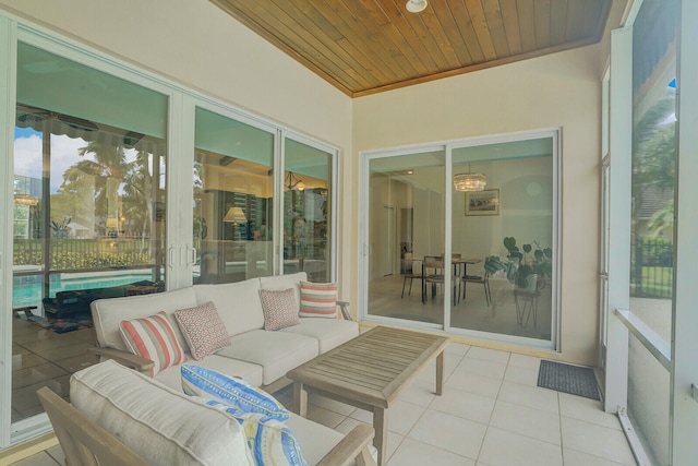 sunroom featuring wood ceiling