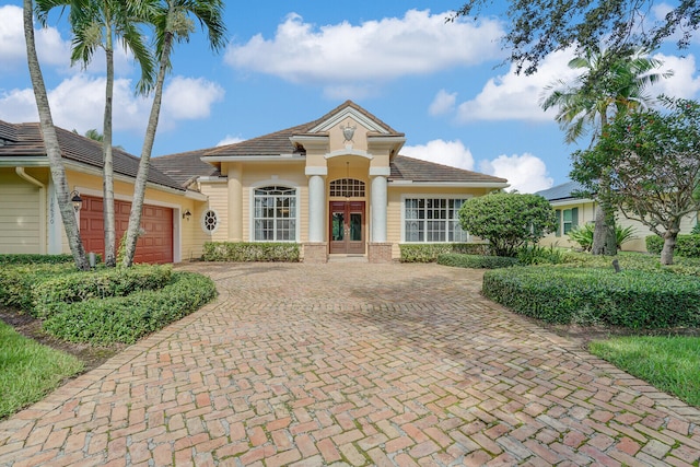 view of front of house with french doors and a garage