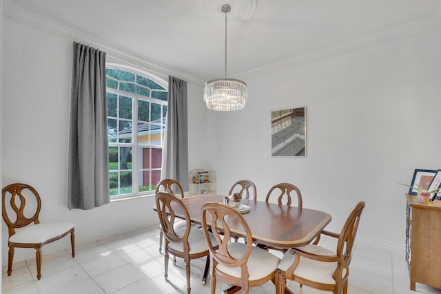 dining space with light tile patterned floors, ornamental molding, and a notable chandelier