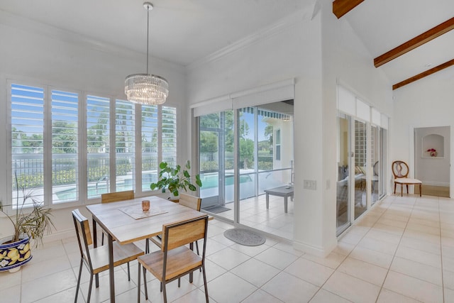 dining space featuring beam ceiling, plenty of natural light, and light tile patterned floors