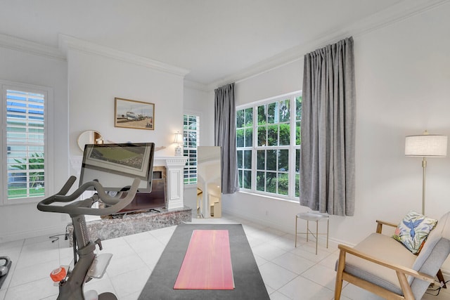 sitting room with light tile patterned floors and crown molding