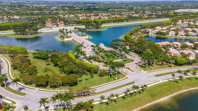 drone / aerial view with a water view and a residential view