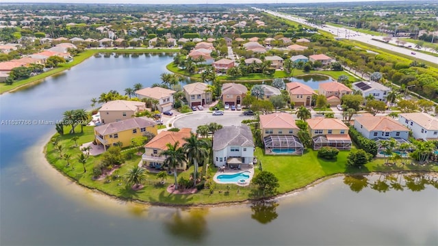 bird's eye view with a residential view and a water view