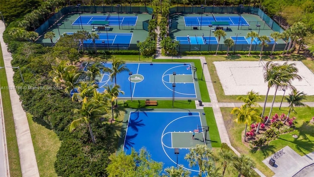 view of basketball court with a tennis court, community basketball court, and fence