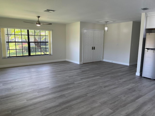 spare room featuring ceiling fan and wood-type flooring