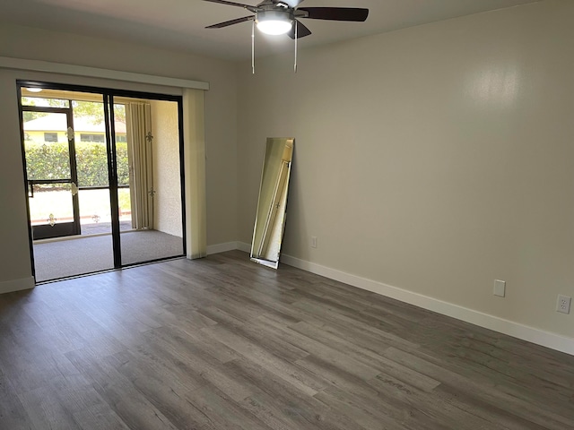 empty room with ceiling fan and wood-type flooring