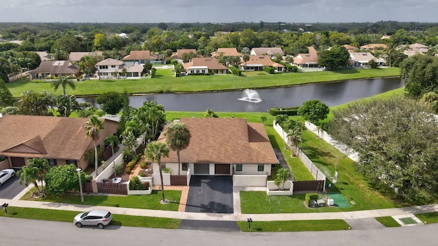 drone / aerial view with a water view