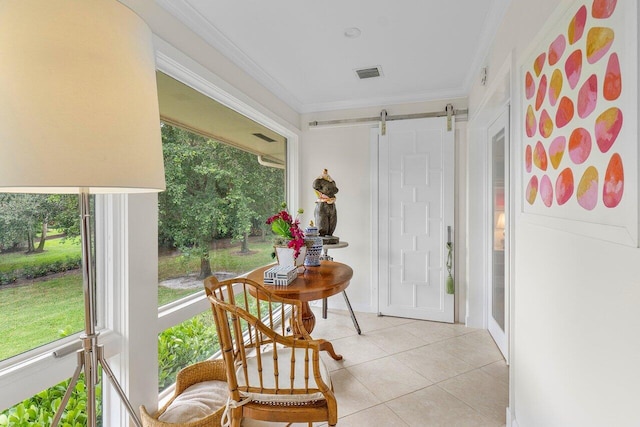 sunroom / solarium featuring a barn door