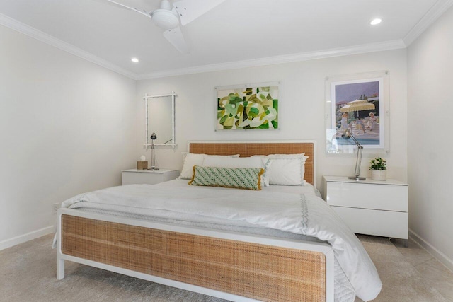 carpeted bedroom with crown molding and ceiling fan