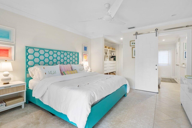 bedroom with light tile patterned floors, ornamental molding, a barn door, and ceiling fan