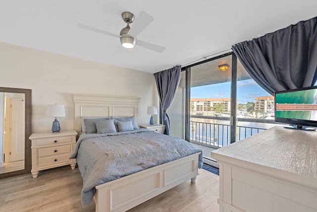 bedroom with access to exterior, light hardwood / wood-style floors, and ceiling fan