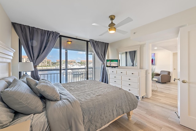 bedroom with access to outside, ceiling fan, and light hardwood / wood-style floors