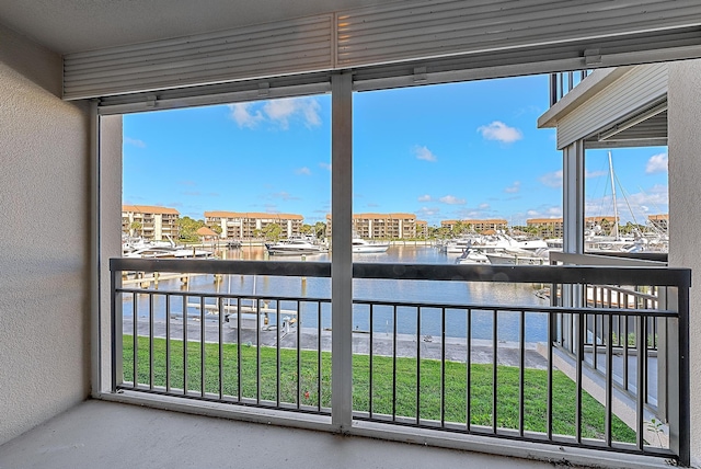 balcony featuring a water view